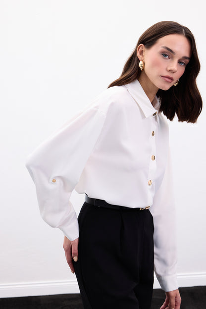 white satin shirt with gold buttons